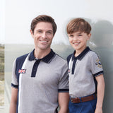 Father and son wearing the Bentley Heritage Stripe Polo Shirt. Shop now at Bentley Kuala Lumpur